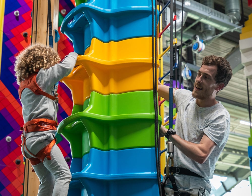 Clip 'N Climb tower with child and dad