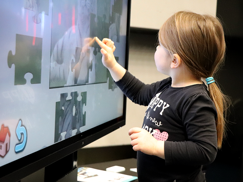 Little girl playing CSE TapWall